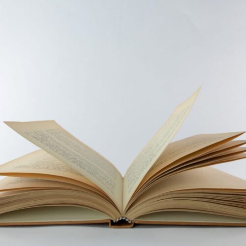 Open,Old,Book,On,A,White,Background